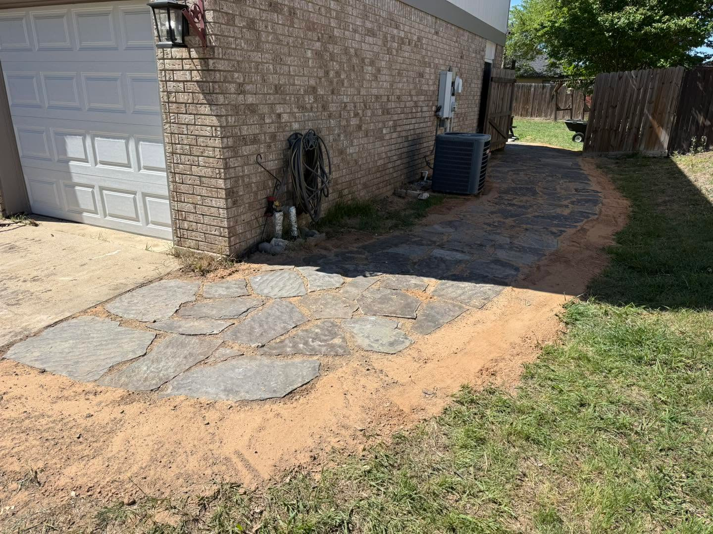 Heavy-duty timber retaining wall installation by landscapers in Temple TX